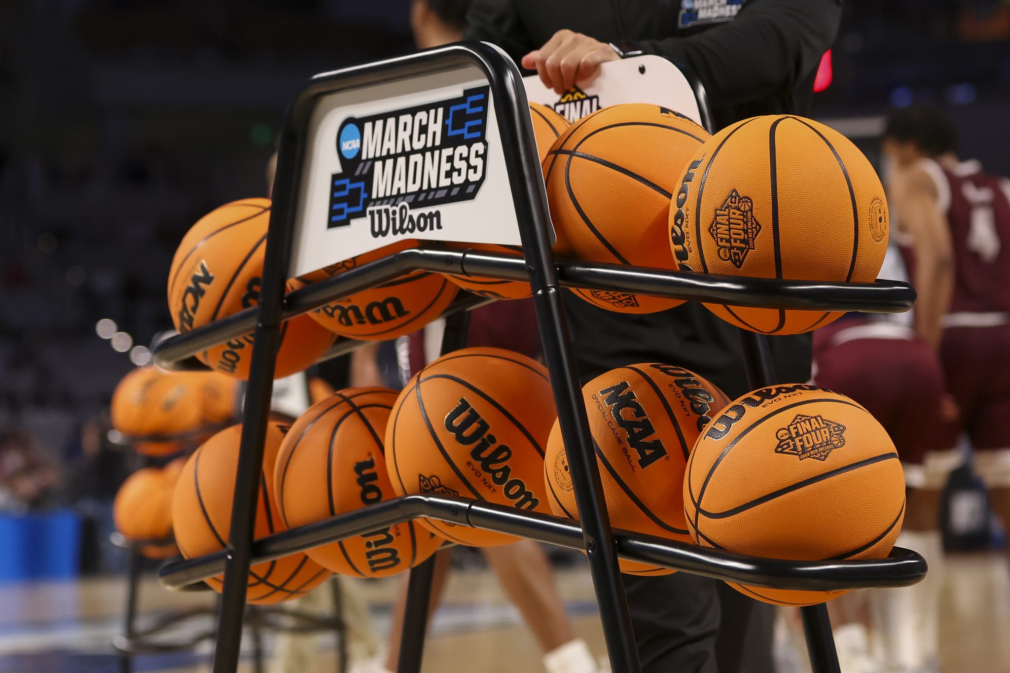 A rack of NCAA Tournament basketballs.